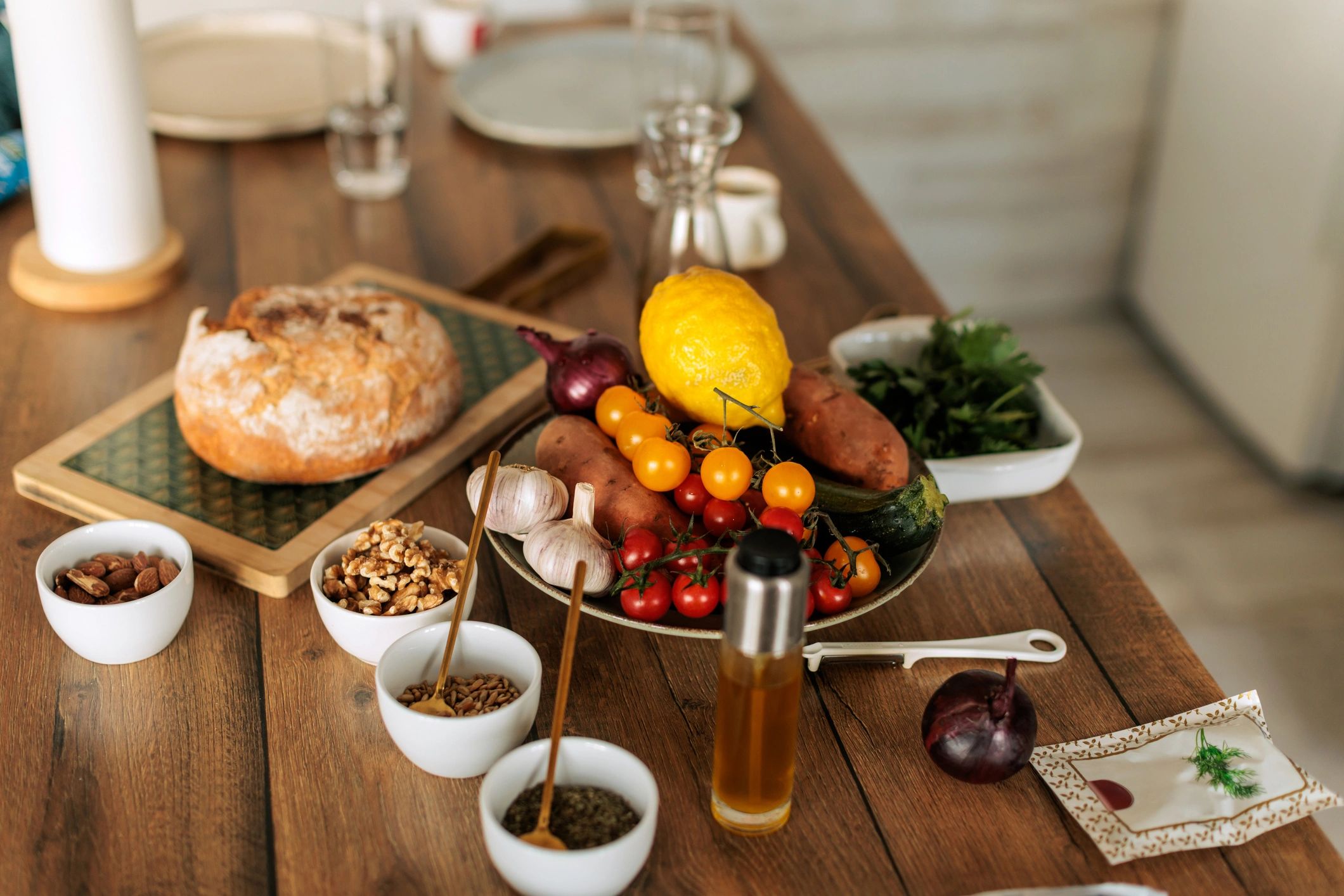 Fresh ingredients arranged on a rustic kitchen table